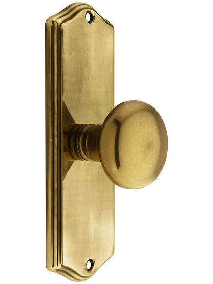 Colonial Revival Door Set With Providence Knobs in Antique Brass.